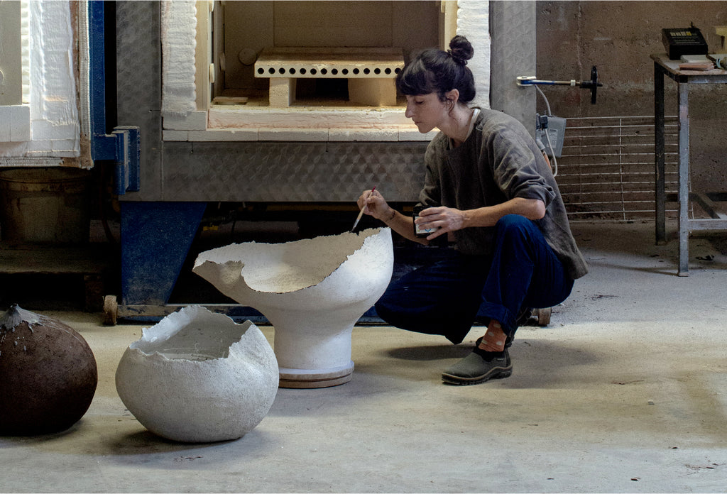 BALKIS PREPARING ONE OF HER WORKS FOR THE KILN AT THE WORKSHOP IN AHETZE, FRANCE