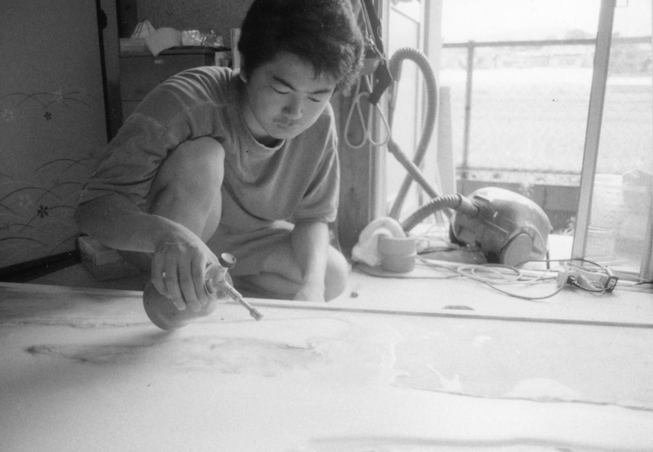ISHIHARA AT WORK AT HIS APARTMENT, AFTER GRADUATING WITH A MASTERS IN SCULPTURE FROM KYOTO CITY UNIVERSITY OF ARTS.